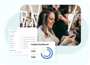 Woman looking at her loyalty points on her phone while sitting in a salon getting her hair done. 